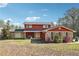 Charming two-story home with red siding and stone accents at 270 Oak Ridge Rd, Covington, GA 30016