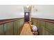 Hallway featuring carpet, wood trim, and a dark-colored front door at 270 Oak Ridge Rd, Covington, GA 30016