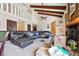 Spacious living room with high ceilings, beams, stone fireplace, and plush seating at 270 Oak Ridge Rd, Covington, GA 30016