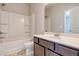 Bathroom featuring a combo tub and shower, modern fixtures, and stylish tile flooring at 293 Depot Landing Rd, Auburn, GA 30011