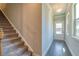 Welcoming foyer with hardwood flooring and a staircase leading to the upper level at 293 Depot Landing Rd, Auburn, GA 30011
