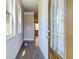 Inviting entryway featuring hardwood floors, crown molding, and natural light from sidelight windows at 293 Depot Landing Rd, Auburn, GA 30011