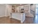 Modern kitchen with stainless steel appliances, granite countertops, and a large island at 293 Depot Landing Rd, Auburn, GA 30011