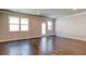 Spacious living room featuring hardwood floors, neutral paint and plenty of natural light at 293 Depot Landing Rd, Auburn, GA 30011