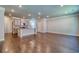 Open-concept living area featuring hardwood floors and a kitchen with a breakfast bar at 293 Depot Landing Rd, Auburn, GA 30011