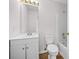 Bathroom features a single vanity, commode, tub and shower with neutral-colored walls at 3920 Cain Mill Dr, Lithonia, GA 30038