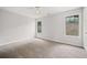 Bedroom with two windows and carpet flooring at 3920 Cain Mill Dr, Lithonia, GA 30038
