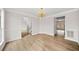 Dining room with hardwood floors and a golden chandelier at 3920 Cain Mill Dr, Lithonia, GA 30038