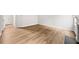 Inviting living room featuring wood-look flooring, a fireplace, and a cozy ambiance at 3920 Cain Mill Dr, Lithonia, GA 30038