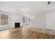 Bright living room features a fireplace, wood floors, and large windows offering natural light at 3920 Cain Mill Dr, Lithonia, GA 30038
