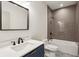 Modern bathroom featuring a vanity, sink, and a stylish tiled shower and tub combination for relaxation at 482 Majestic Oaks Pl, Smyrna, GA 30082
