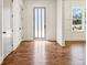 Elegant entryway featuring hardwood floors, white trim, and a stylish front door with side windows at 482 Majestic Oaks Pl, Smyrna, GA 30082