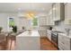 Modern kitchen with a spacious island, quartz countertops, stainless steel appliances, and stylish backsplash at 482 Majestic Oaks Pl, Smyrna, GA 30082
