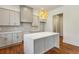 New kitchen with large island, white countertops, gray cabinets, modern light fixture and wood floors at 482 Majestic Oaks Pl, Smyrna, GA 30082