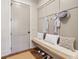 Inviting mudroom features a cushioned bench with decorative pillows and convenient storage for shoes and outerwear at 482 Majestic Oaks Pl, Smyrna, GA 30082