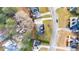 Overhead view of a home, showcasing its roof, landscaping, driveway, and surrounding neighborhood at 633 Windy Mill Xing, Temple, GA 30179