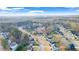 A scenic aerial shot showcases a vibrant neighborhood with well-maintained homes and lush trees at 633 Windy Mill Xing, Temple, GA 30179
