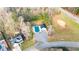 Expansive property featuring a pool, parking area, and lush natural surroundings bordering the main road at 633 Windy Mill Xing, Temple, GA 30179