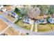 Aerial view showcasing the property nestled in a residential neighborhood with mature trees and landscaping at 633 Windy Mill Xing, Temple, GA 30179