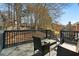 Wood back deck with dark wood seating and a view of the yard at 633 Windy Mill Xing, Temple, GA 30179