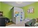 Fun bedroom featuring lofted bed with desk area, and green accent wall at 633 Windy Mill Xing, Temple, GA 30179