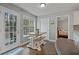 Cozy breakfast nook with a farmhouse-style table and access to the deck at 633 Windy Mill Xing, Temple, GA 30179