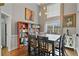 Elegant dining room with hardwood floors, large windows, and stylish decor at 633 Windy Mill Xing, Temple, GA 30179