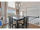 Bright dining room with large windows, hardwood floors, and elegant lighting fixture at 633 Windy Mill Xing, Temple, GA 30179
