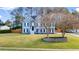 Two-story home featuring a manicured lawn, stone accents and long driveway, great curb appeal at 633 Windy Mill Xing, Temple, GA 30179
