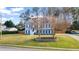 Charming two-story home featuring a manicured lawn and a spacious driveway, great curb appeal at 633 Windy Mill Xing, Temple, GA 30179