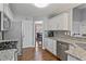 Modern kitchen with granite countertops, stainless steel appliances, and mosaic tile backsplash at 633 Windy Mill Xing, Temple, GA 30179