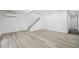 Spacious basement with new vinyl floors, recessed lighting, and staircase at 6337 Lake View Dr, Buford, GA 30518