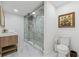 Bathroom featuring glass enclosed shower with white marble, tile, and vanity with white marble top at 6337 Lake View Dr, Buford, GA 30518