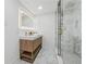 Modern bathroom with walk-in glass shower, modern vanity, and sleek, minimalist design at 6337 Lake View Dr, Buford, GA 30518