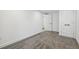 Bedroom with carpeted floor, white doors and walls and modern trim at 6337 Lake View Dr, Buford, GA 30518