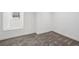 Bedroom featuring a carpeted floor, a window, and crisp white walls at 6337 Lake View Dr, Buford, GA 30518