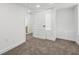 Bedroom with carpeted floor and a door to the closet with a white door at 6337 Lake View Dr, Buford, GA 30518