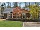Charming home featuring manicured front lawn and meticulous landscaping at 6337 Lake View Dr, Buford, GA 30518