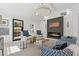 Comfortable living room with stylish seating, fireplace, and bright natural light at 6337 Lake View Dr, Buford, GA 30518
