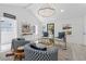 Well-lit living room with high ceilings, modern furnishings, and views of the outdoors at 6337 Lake View Dr, Buford, GA 30518