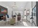 Bright living room featuring a modern chandelier, fireplace, and stylish decor at 6337 Lake View Dr, Buford, GA 30518