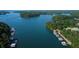 An aerial view shows the lake with docks lining the shore; perfect for the boating enthusiast at 6337 Lake View Dr, Buford, GA 30518
