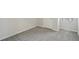 Bedroom has neutral gray carpet, white trim, and a window with blinds at 7004 Panda Ln, Austell, GA 30168