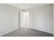 Bedroom features neutral gray carpet, white trim, and a closet at 7004 Panda Ln, Austell, GA 30168