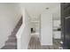 Inviting entryway showcasing gray walls, modern flooring, and staircase to upper level at 7004 Panda Ln, Austell, GA 30168