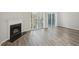 Bright living room features a fireplace and sliding glass doors to the backyard patio at 7004 Panda Ln, Austell, GA 30168