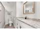A modern bathroom features granite countertops, and a clean, stylish design at 2374 Buchanan Hwy, Dallas, GA 30157