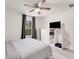 Cozy bedroom with window, modern furnishings, and wood-look floors, with relaxing ambiance at 2374 Buchanan Hwy, Dallas, GA 30157