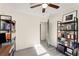 An office/bedroom boasts ample natural light, built-in bookshelves and sleek flooring at 2374 Buchanan Hwy, Dallas, GA 30157