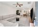 Open-concept living room with a sectional sofa, dining area, stainless steel refrigerator, washer and dryer at 2374 Buchanan Hwy, Dallas, GA 30157